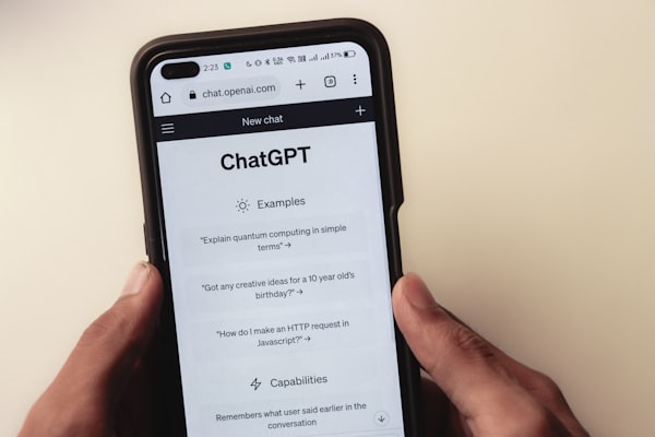 Customer interacting with AI support chatbot on mobile phone for automated customer service