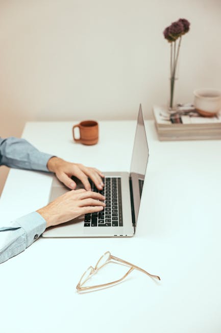 Solopreneur working on email marketing at a clean minimalist desk setup