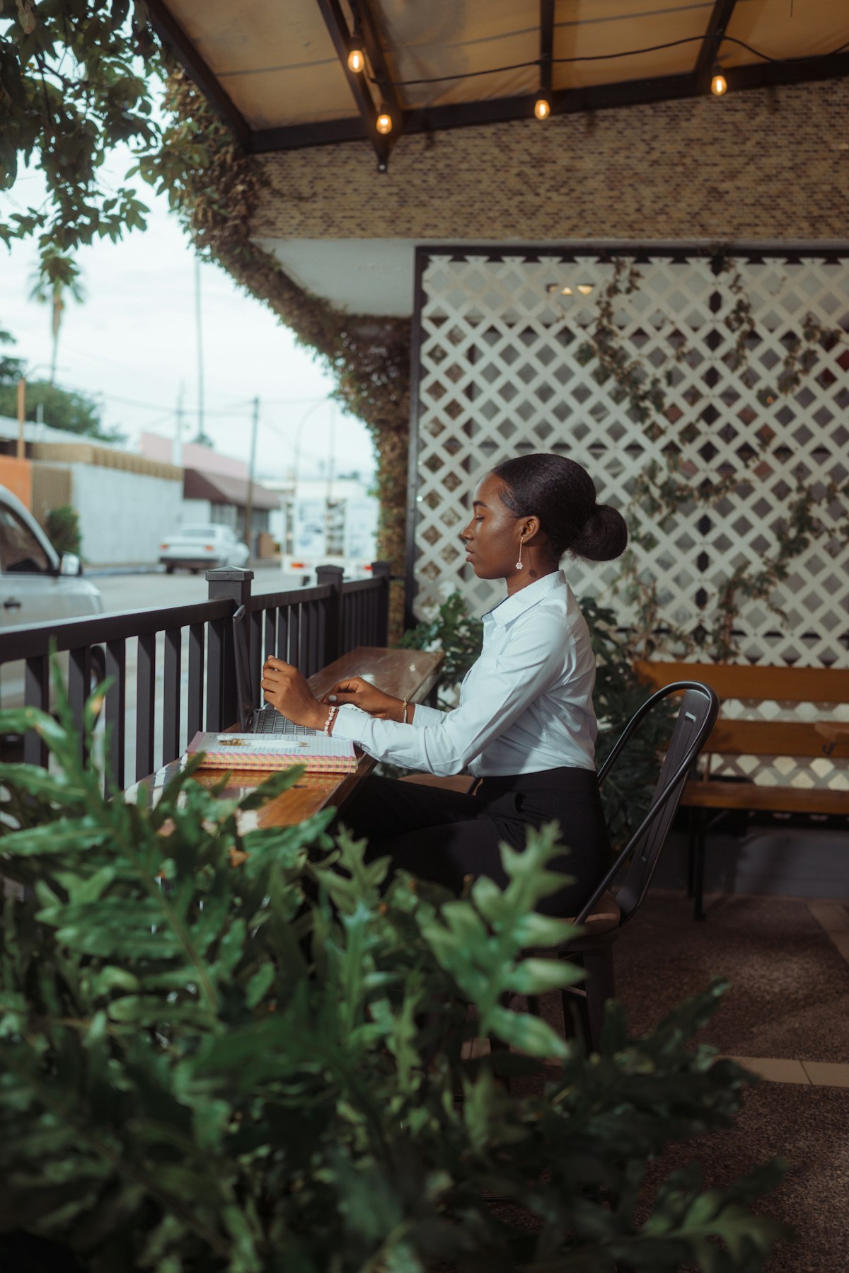 freelancer mapping AI automation workflow in notebook before launching automations