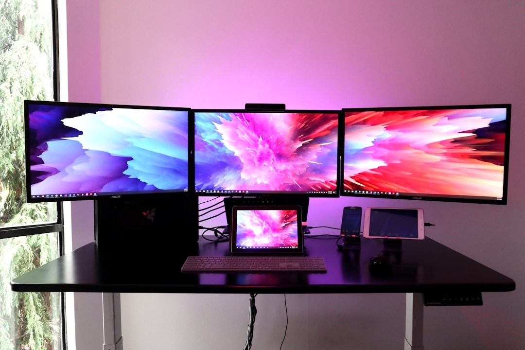 Multi-screen productivity desk setup for solopreneur AI workflow