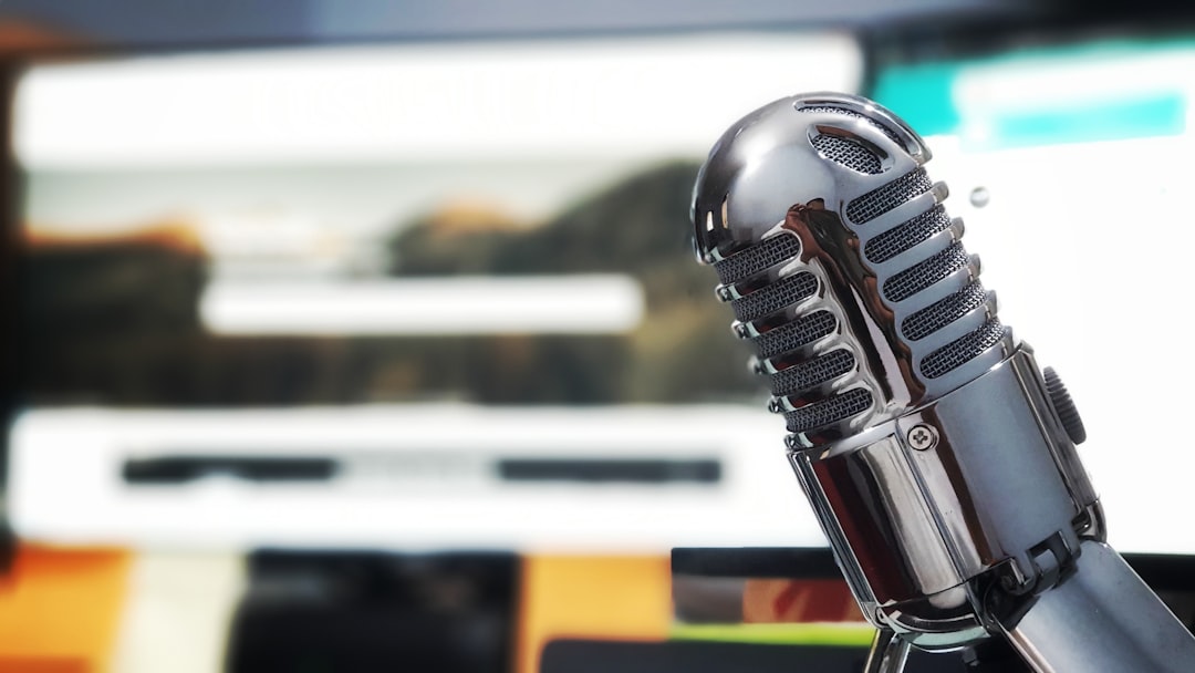 Podcast recording desk setup with audio equipment for transcription