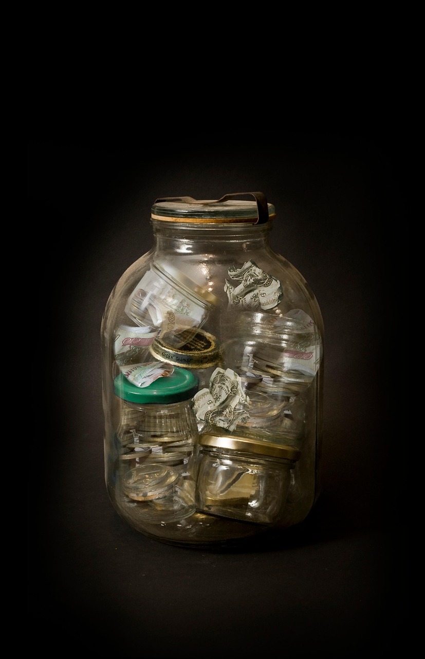 savings jar showing personal money management for solopreneurs