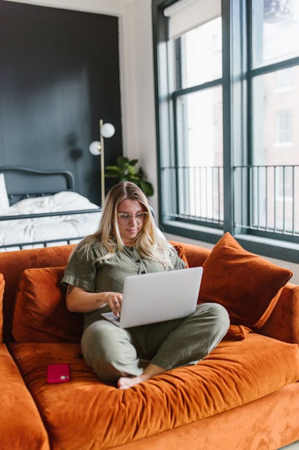 Solo founder working from home office with laptop and AI tools