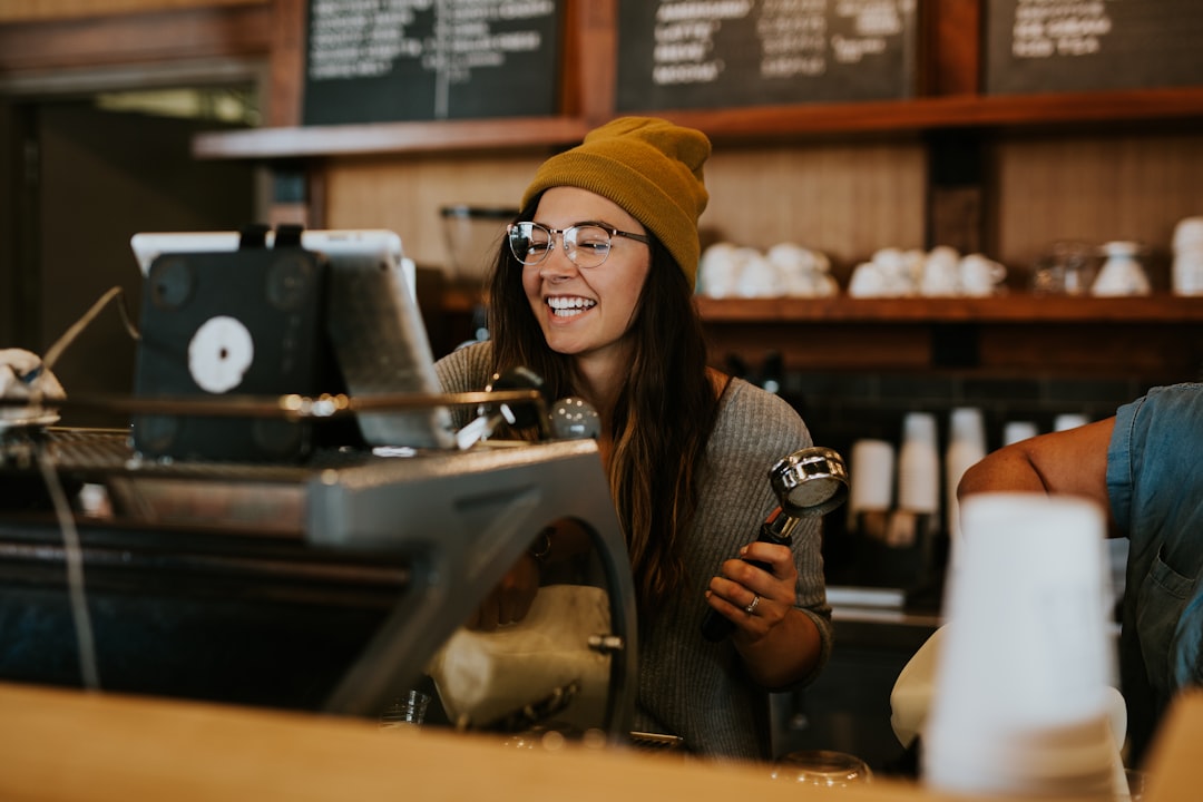 Coffee shop owner reviewing Claude for Small Business agentic workflows