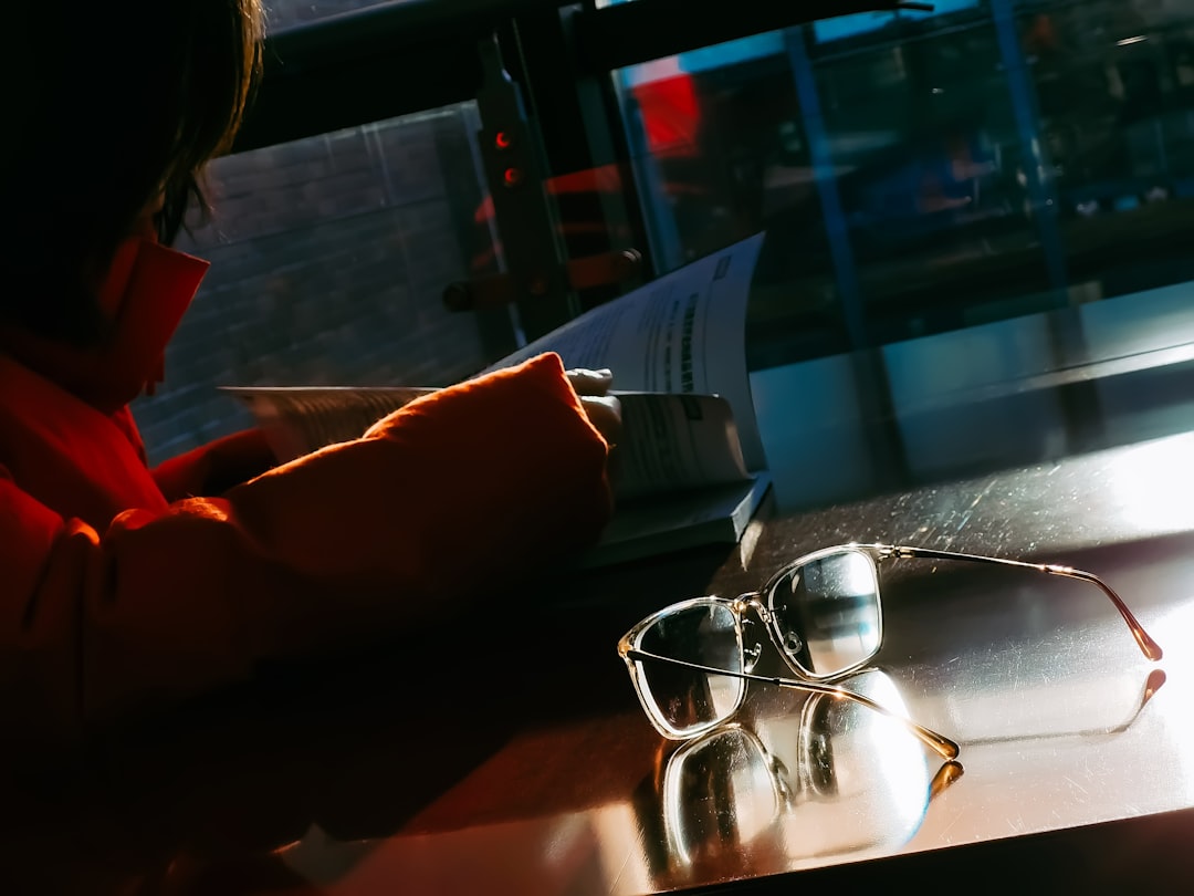 Freelancer reviewing a client contract carefully at a home office desk