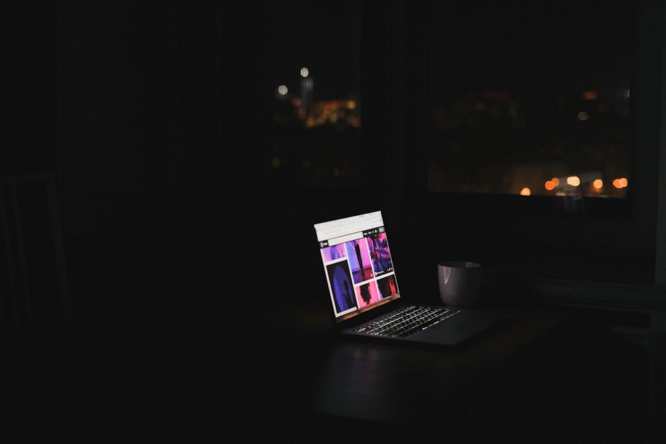 Solo founder working at laptop reviewing Telegram bot permissions and replies