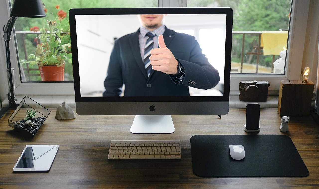 solopreneur using zoom video meeting in modern home office