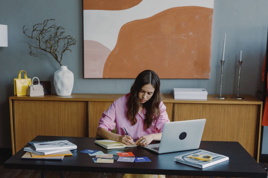 Solopreneur working from home office on laptop